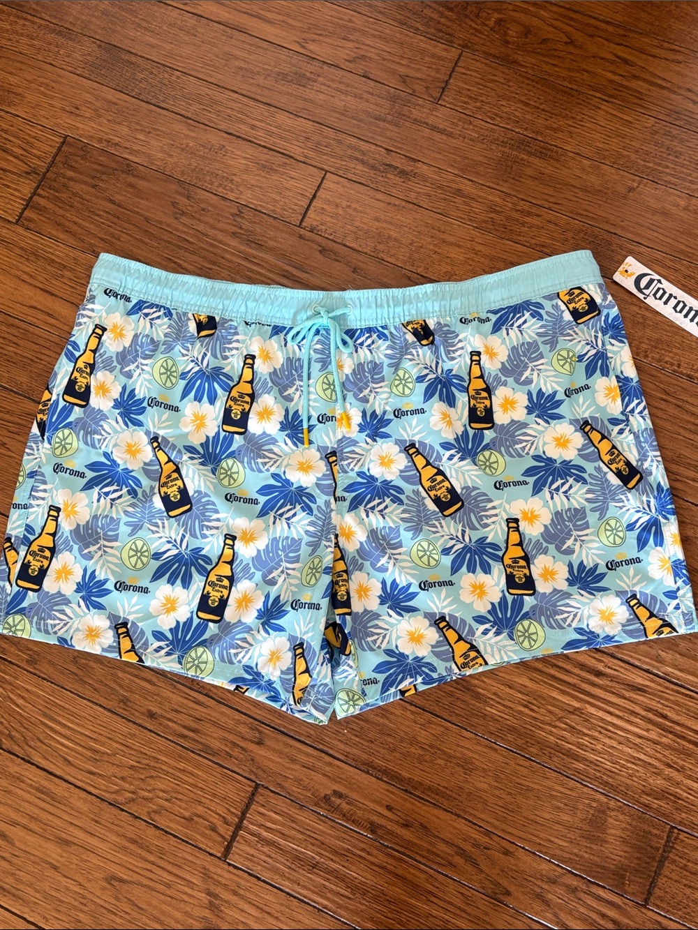 Corona Light Blue Tropical Bottle Print Men’s Swim Trunks